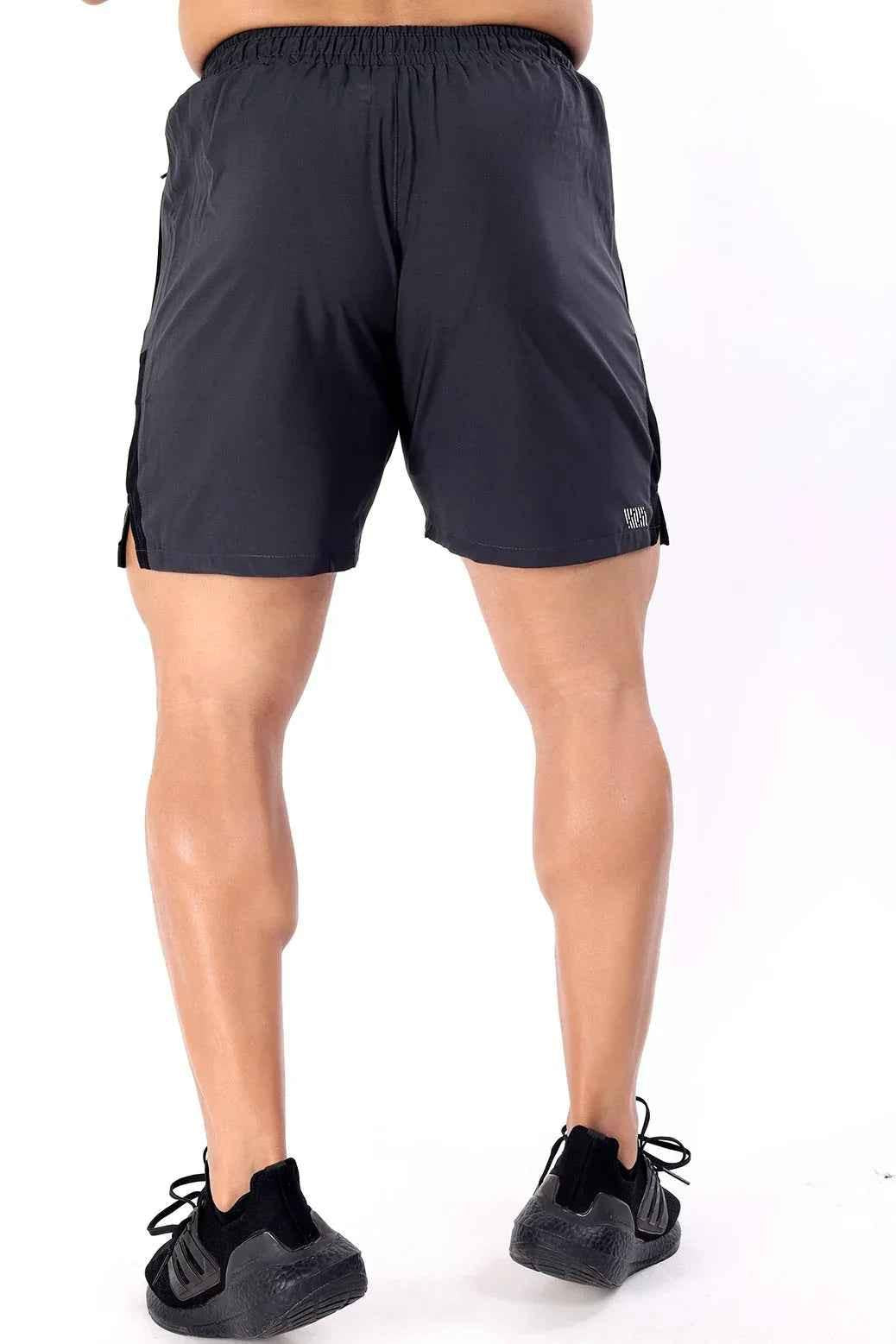 Fuaark Nz grey Studio Shorts displayed on a model, showcasing their relaxed fit and casual style.