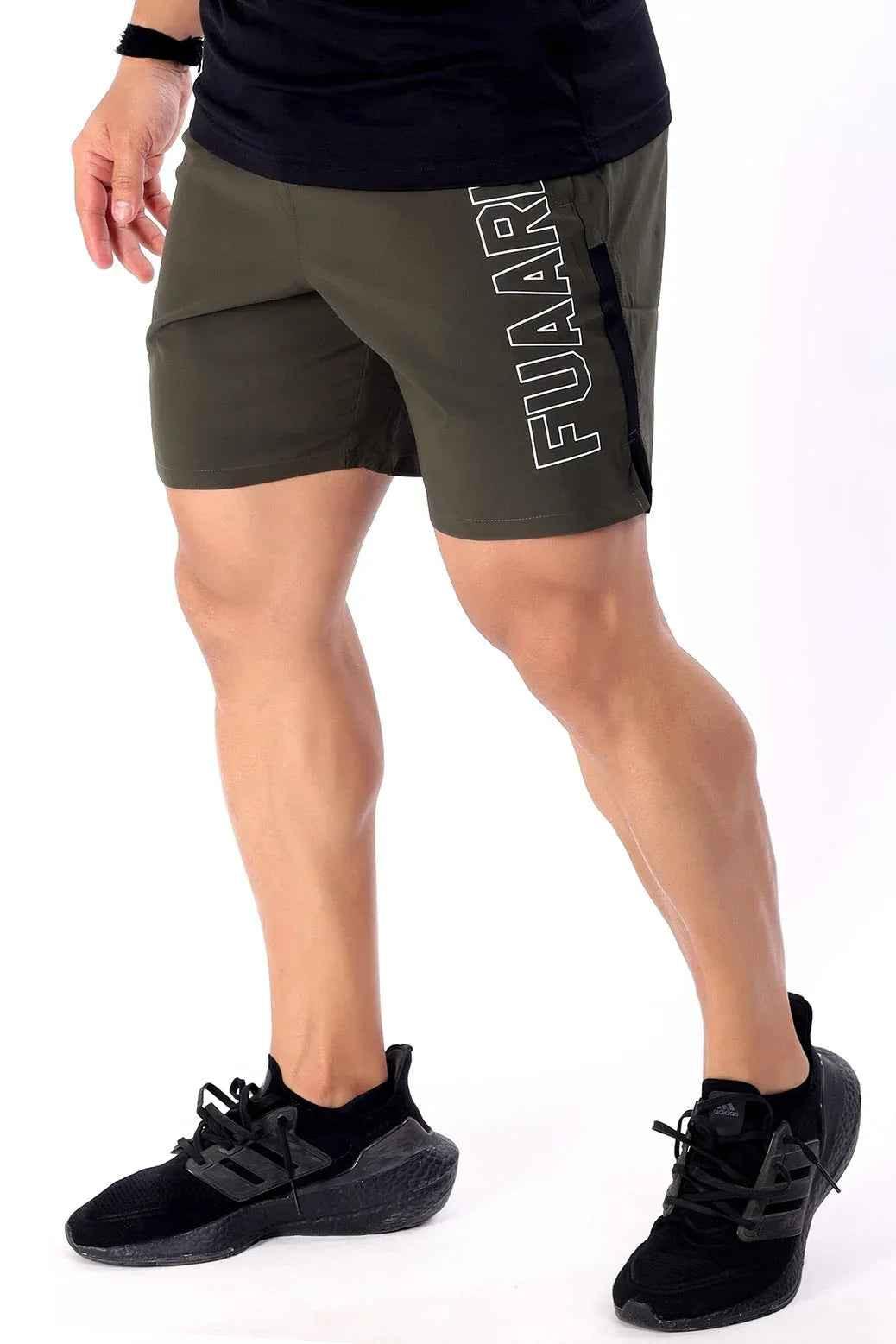 Olive green Fuaark Nz Studio Shorts displayed on a model, showcasing casual fit and comfortable design.