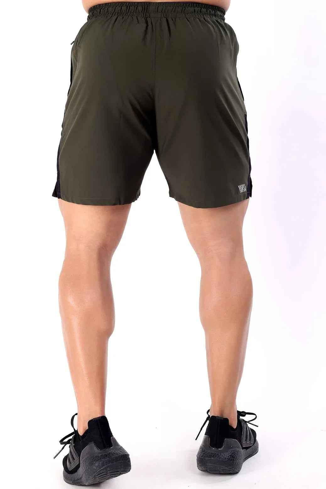 Olive green Fuaark Nz Studio Shorts laid flat, showcasing their relaxed fit and casual style for comfortable summer wear.