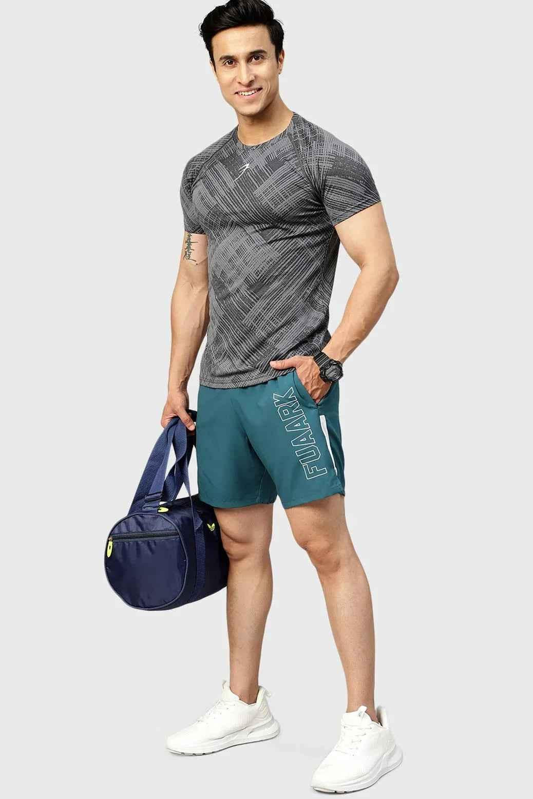 Teal Fuaark Nz Studio Shorts laid flat, showcasing soft fabric, elastic waistband, and stylish casual design.