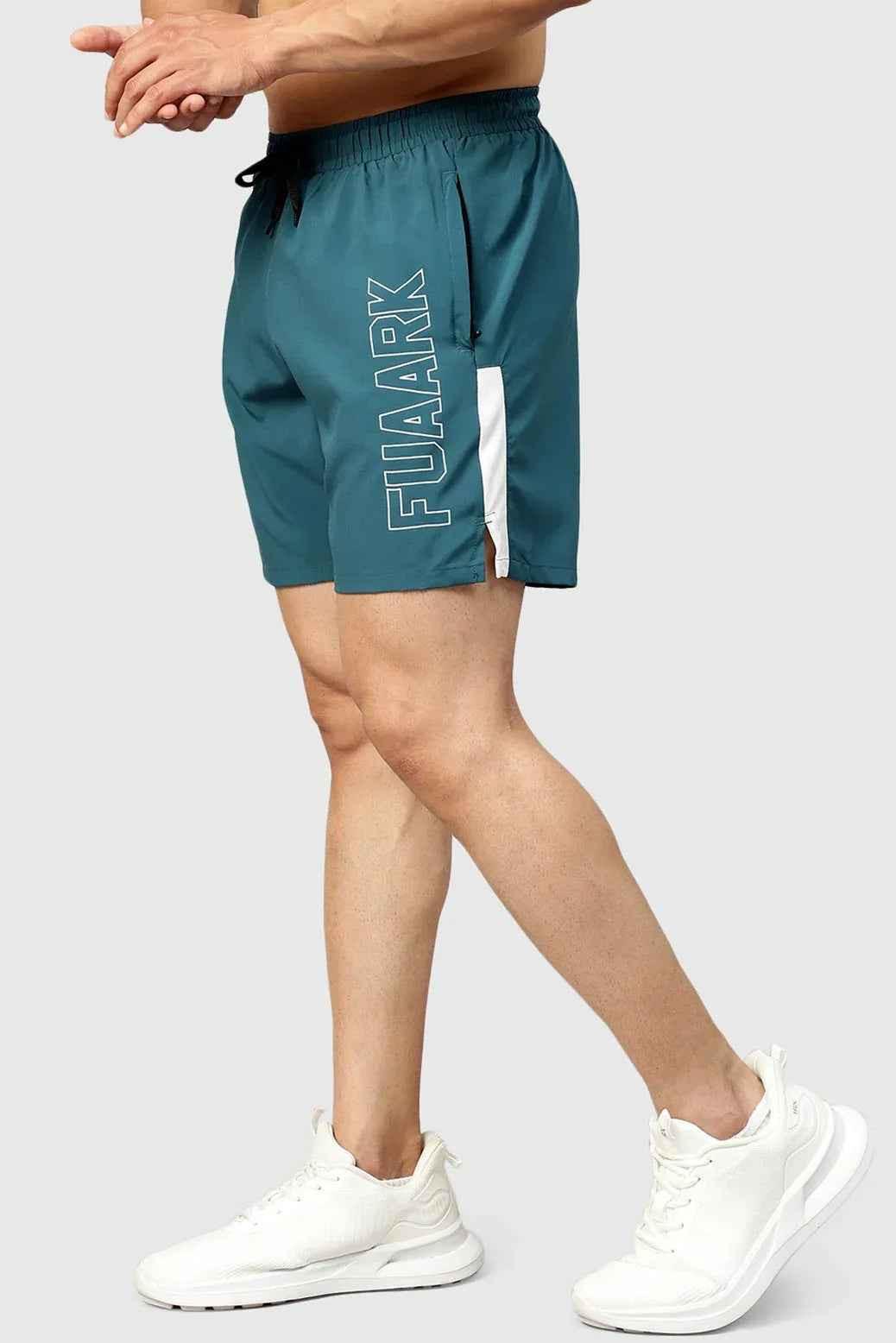 Fuaark Nz Studio Shorts in teal color, featuring a comfortable fit and casual style, shown on a model.