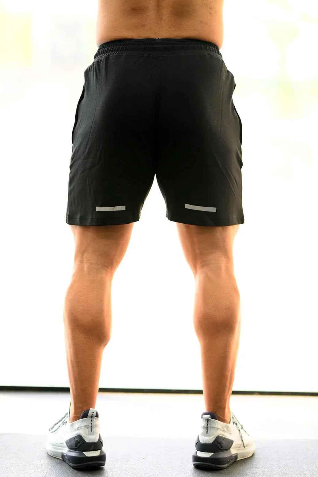 Fuaark Nz Ultra Black Shorts for men, showcasing a comfortable fit and stylish design in a close-up view.