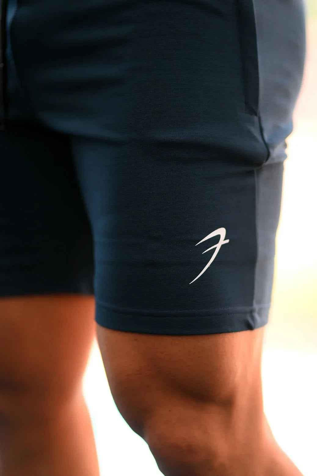 Fuaark Nz Ultra Shorts in teal color, featuring a comfortable fit and sporty design, shown on a model.