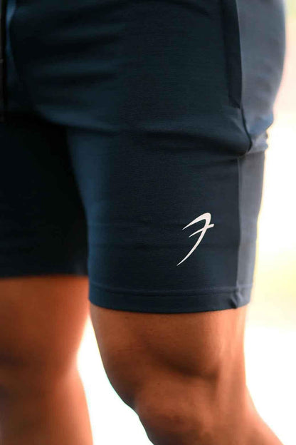 Fuaark Nz Ultra Shorts in teal color, featuring a comfortable fit and sporty design, shown on a model.