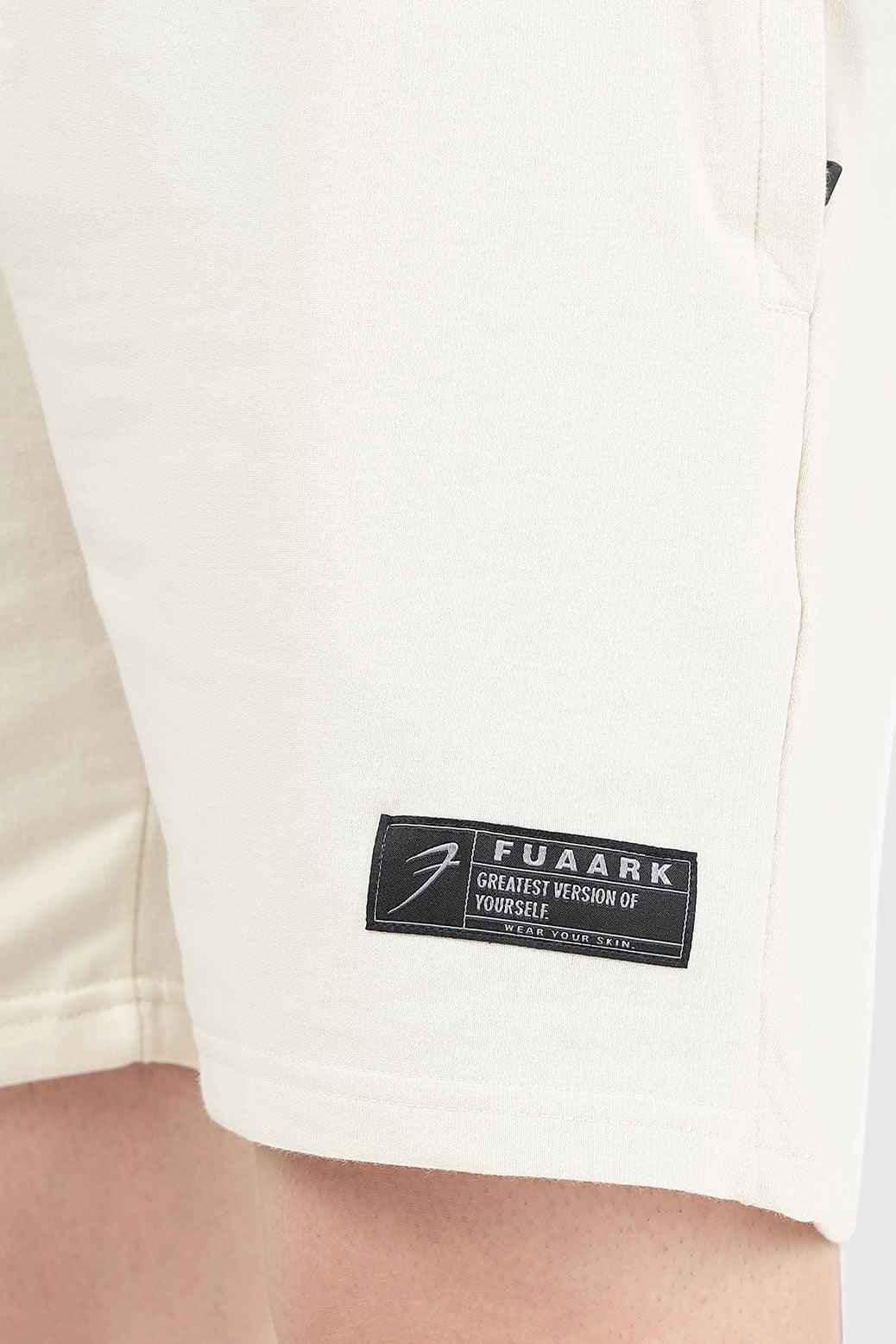 Beige Fuaark Nz Venture Shorts laid flat, showing lightweight fabric and simple design, ideal for casual wear.