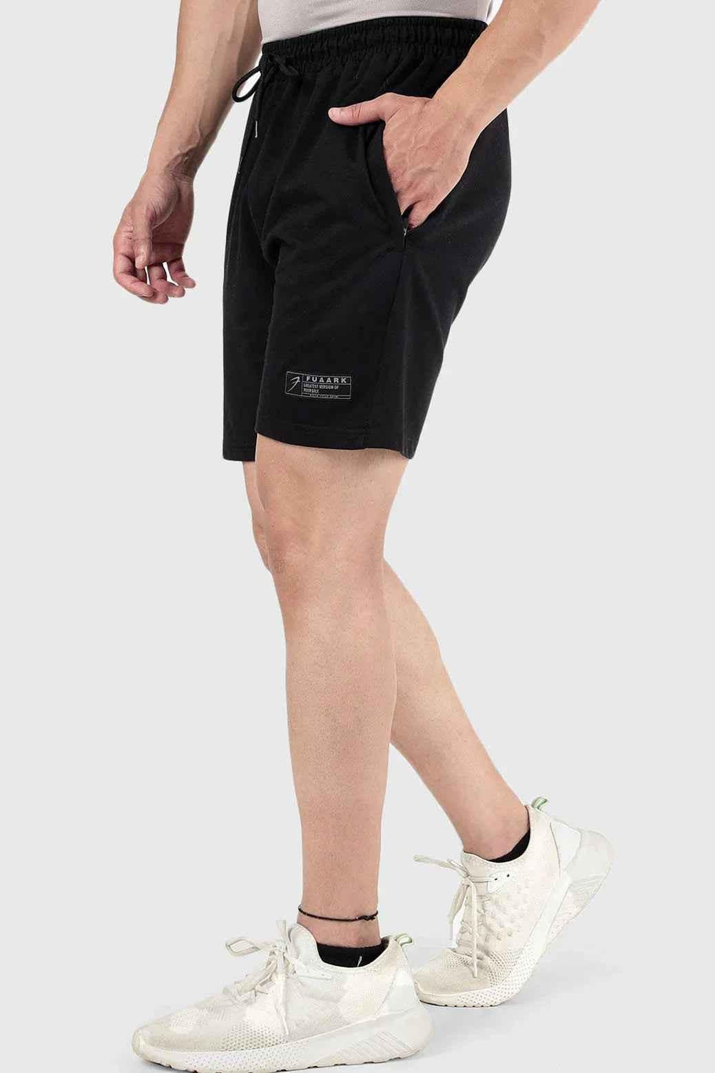 Black Fuaark NZ Venture Shorts laid flat, showcasing their casual design and comfortable fit.