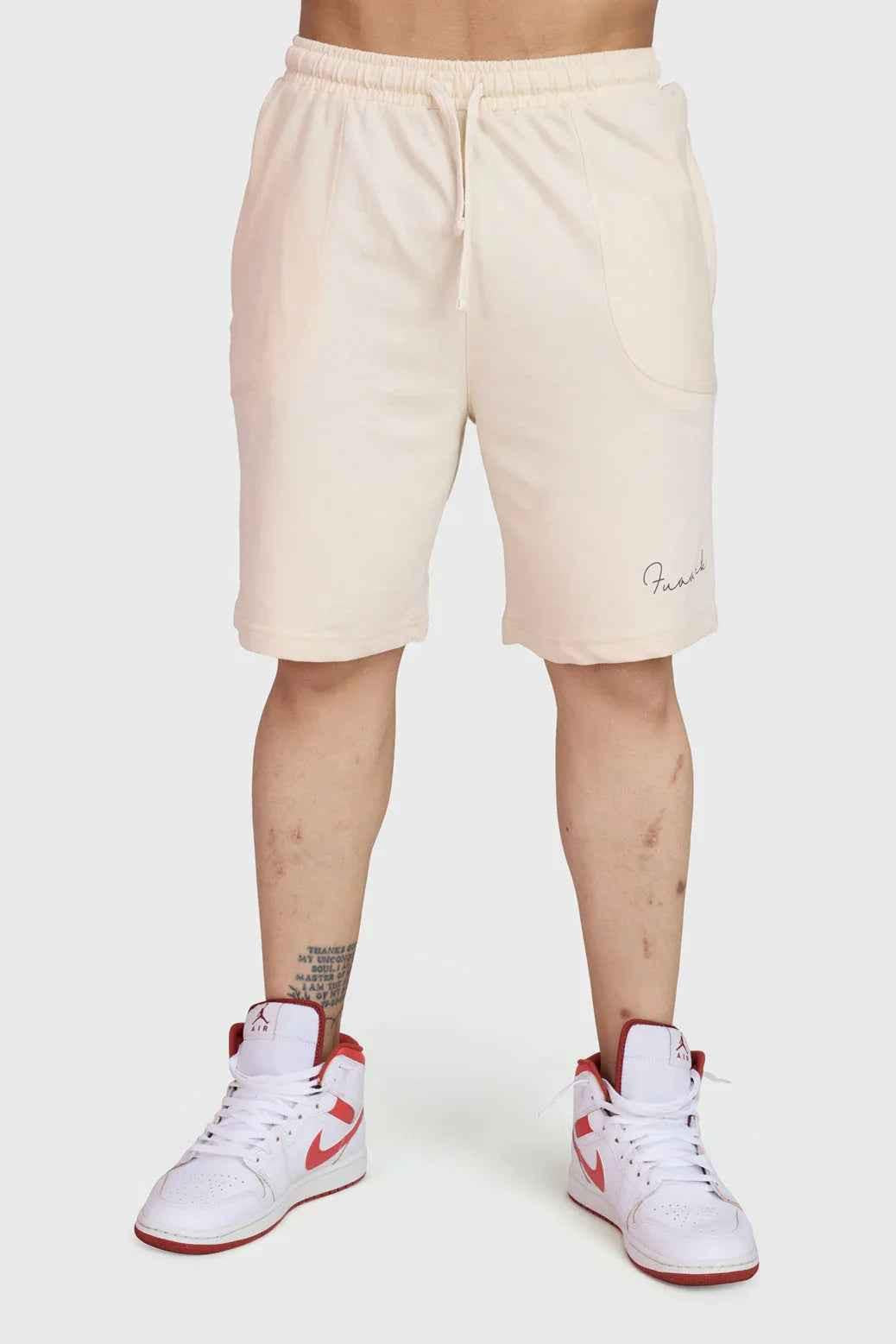 Beige oversized shorts by Fuaark Nz, designed for comfort, with a relaxed fit and casual style.