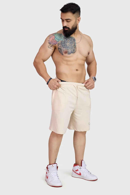 Beige oversized shorts from Fuaark Nz, designed for comfort, with a relaxed fit and casual style.