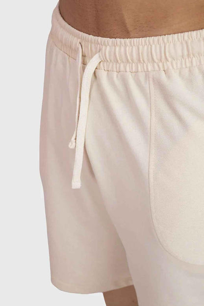 Beige oversized shorts by Fuaark Nz, designed for comfort, with a relaxed fit and casual style for weekend wear.