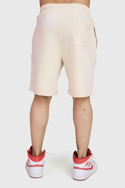 Fuaark Nz beige oversized shorts for women, featuring a relaxed fit and casual style perfect for weekend comfort.