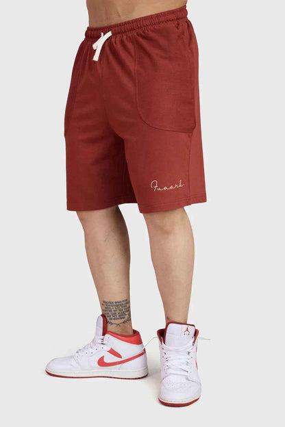 Fuaark Nz Weekend Rust oversized shorts made of soft fabric, displayed on a hanger with a relaxed fit and casual style.
