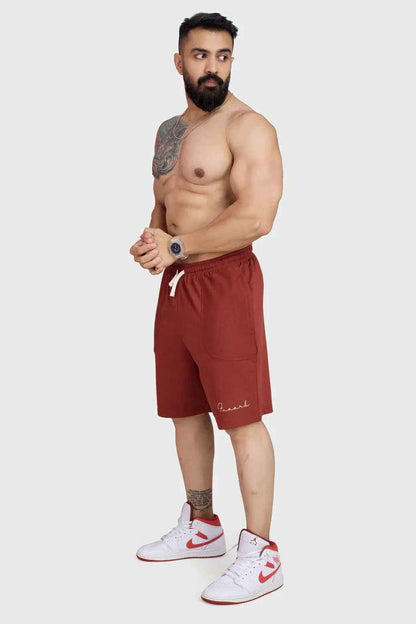 Rust-colored oversized shorts by Fuaark Nz, designed for comfort, with a relaxed fit and casual style.