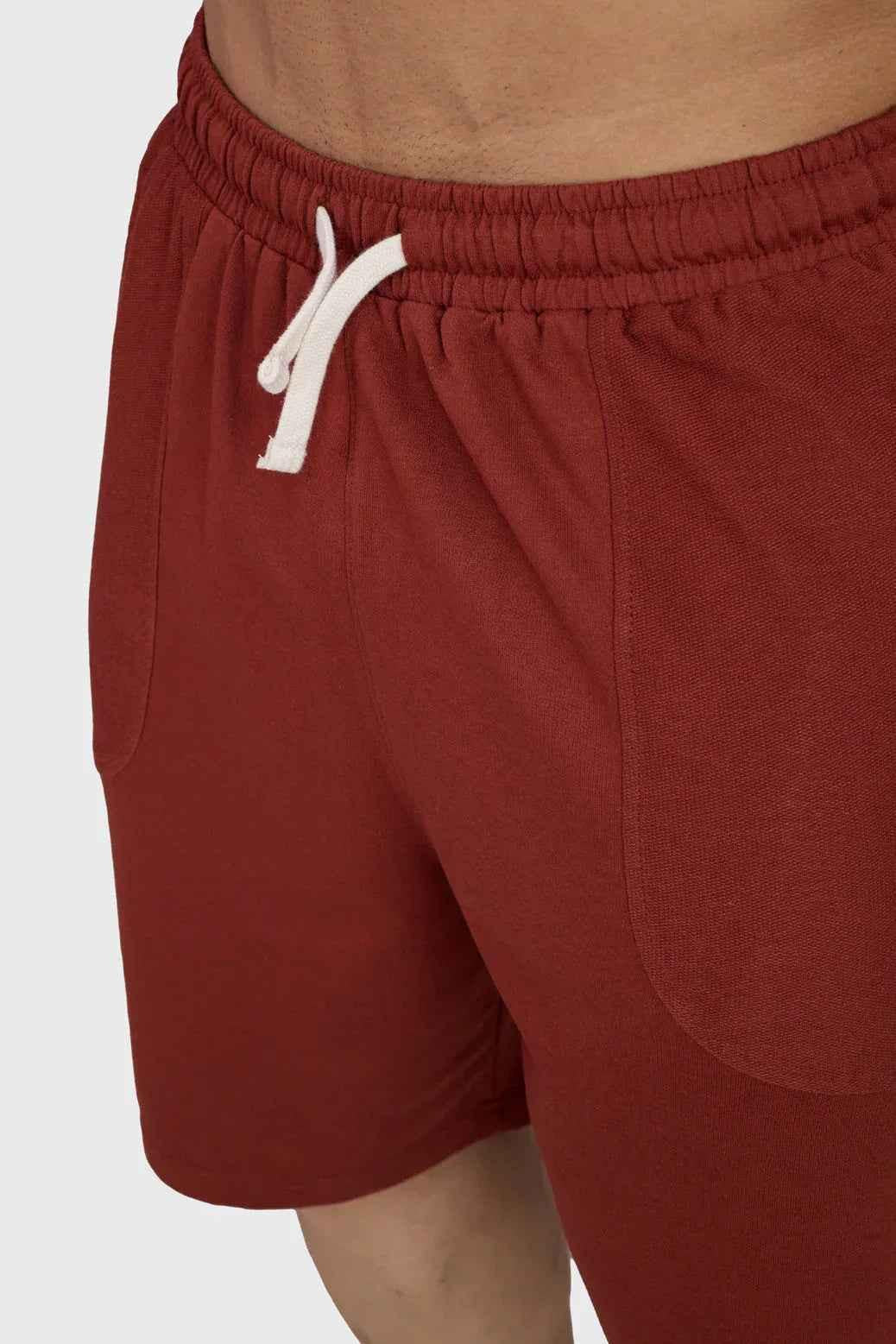 Rust-colored oversized shorts by Fuaark NZ featuring a relaxed fit and casual style, perfect for weekend comfort.