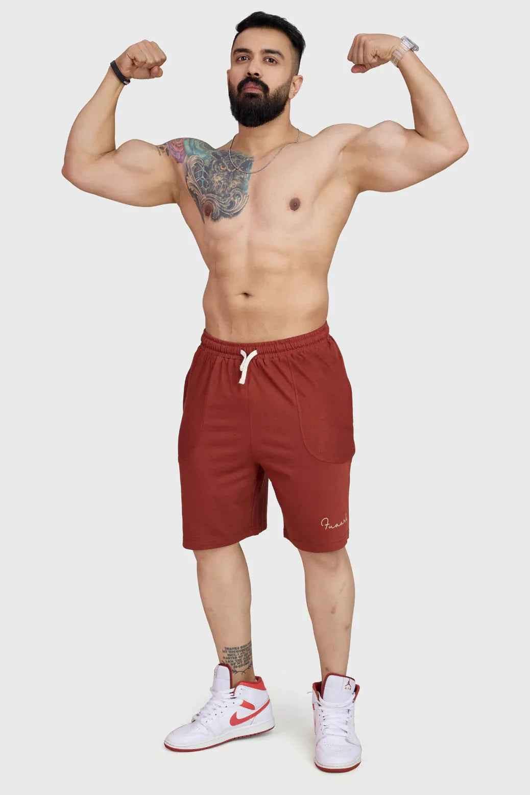 Rust-colored oversized shorts by Fuaark Nz, designed for comfort, with a relaxed fit and casual style.