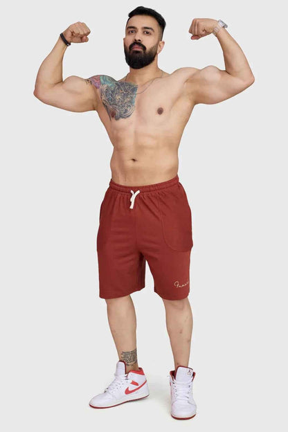 Rust-colored oversized shorts by Fuaark Nz, designed for comfort, with a relaxed fit and casual style.