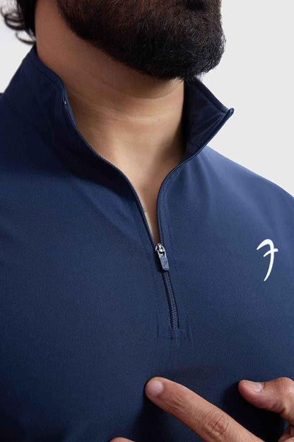 Navy blue Fuaark NZ Thread Pullover sweater displayed on a hanger, showcasing its soft knit fabric and classic crewneck design.