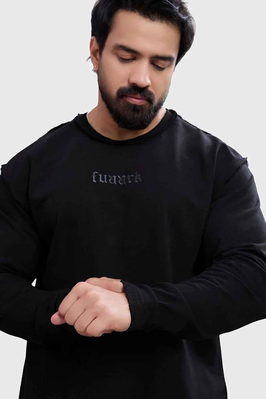 Black Shell Raw sweatshirt by Fuaark Nz, featuring a casual fit and soft fabric, displayed on a mannequin.