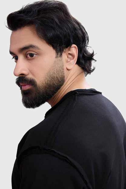 Black Shell Raw Sweatshirt by Fuaark Nz, showcasing a comfortable sweatshirt with a relaxed fit and minimalist design.