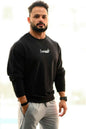 Black oversized sweatshirt by Fuaark NZ featuring a cozy, relaxed fit for effortless style and comfortable wear.