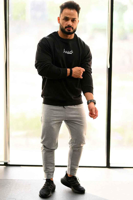 Black oversized sweatshirt from Fuaark Nz, cozy and stylish, perfect for effortless casual wear.