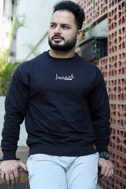 Black oversized sweatshirt from Fuaark Nz, showcasing a cozy, relaxed fit perfect for effortless style and comfort.
