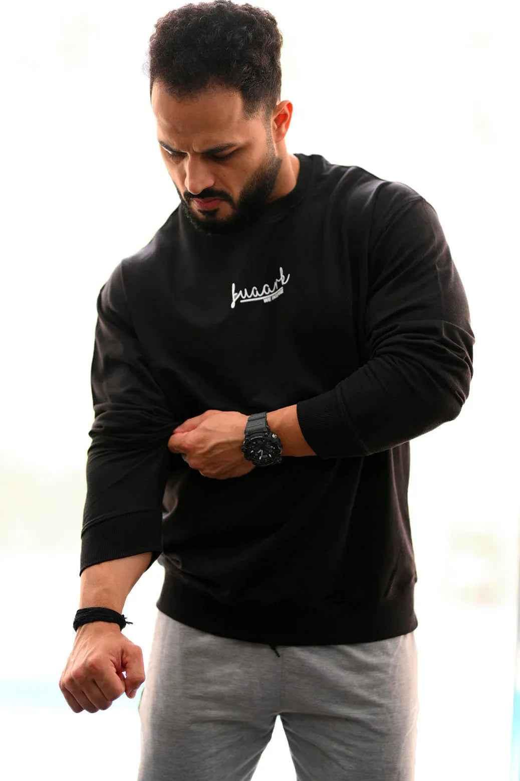 Black oversized sweatshirt by Fuaark Nz featuring a cozy, relaxed fit ideal for effortless style and comfort.