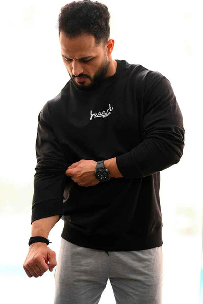 Black oversized sweatshirt by Fuaark Nz featuring a cozy, relaxed fit ideal for effortless style and comfort.