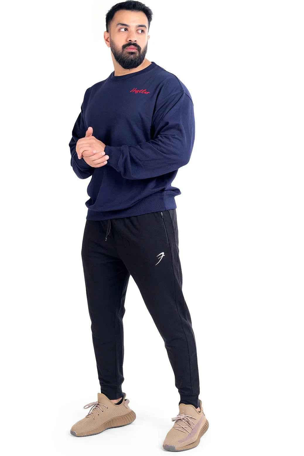 Navy Hustler oversized sweatshirt by Fuaark Nz, featuring a relaxed fit and soft fabric, displayed on a hanger.