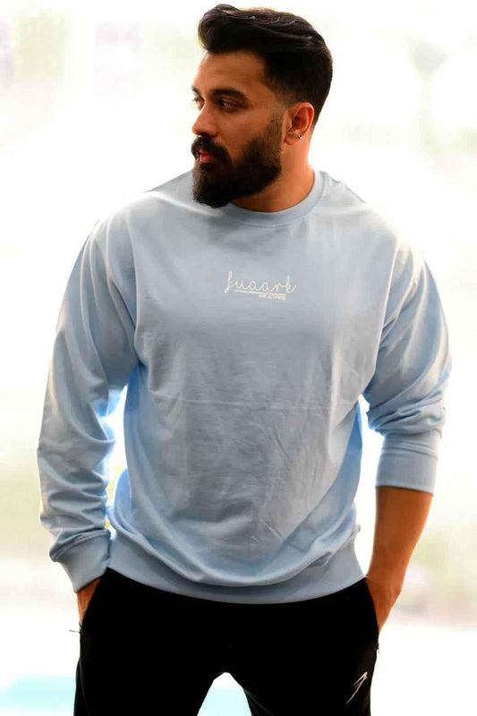 Sky blue oversized sweatshirt by Fuaark Nz, featuring a relaxed fit and soft fabric for comfortable, stylish casual wear.