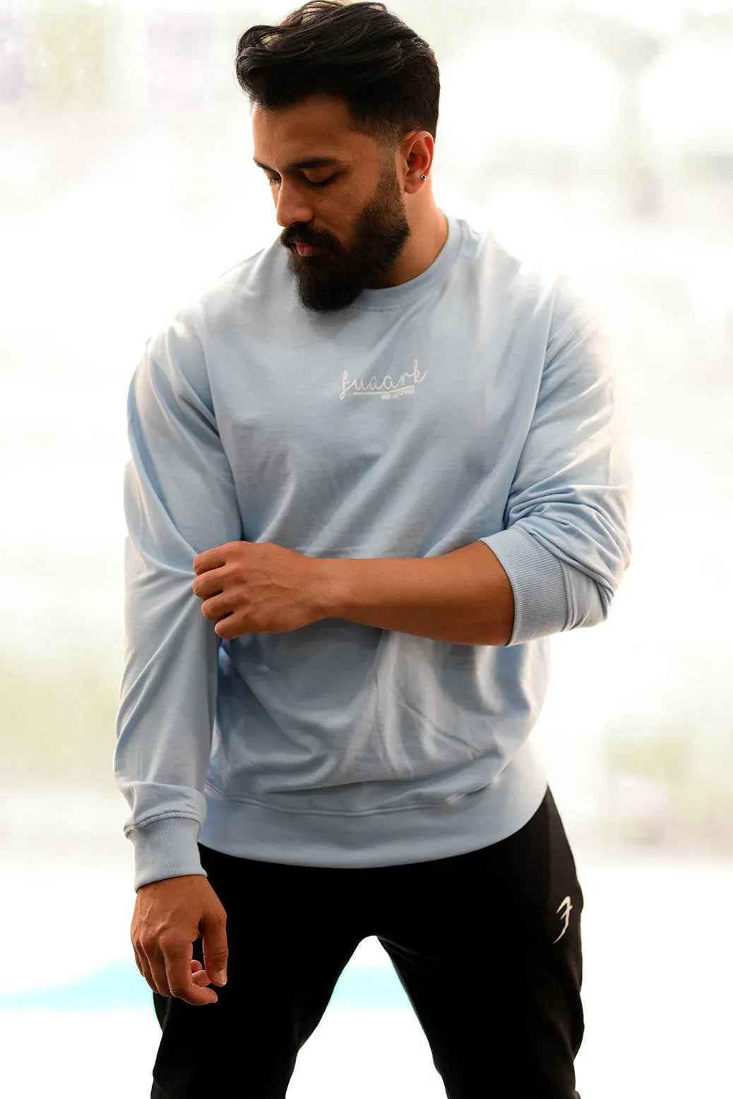 Sky blue oversized sweatshirt by Fuaark Nz, featuring a cozy fit and casual style, perfect for comfortable everyday wear.