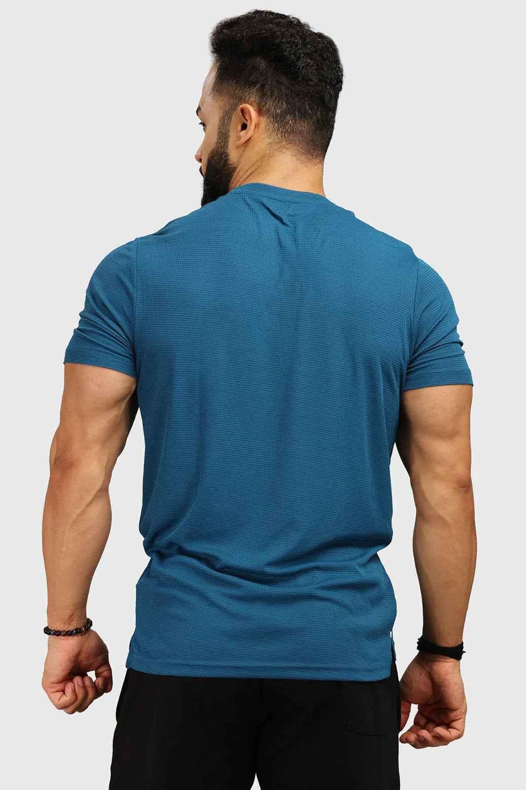 Fuaark Nz teal Checks Regular T-shirt, casual fit, soft fabric, with a checkered pattern and round neckline.