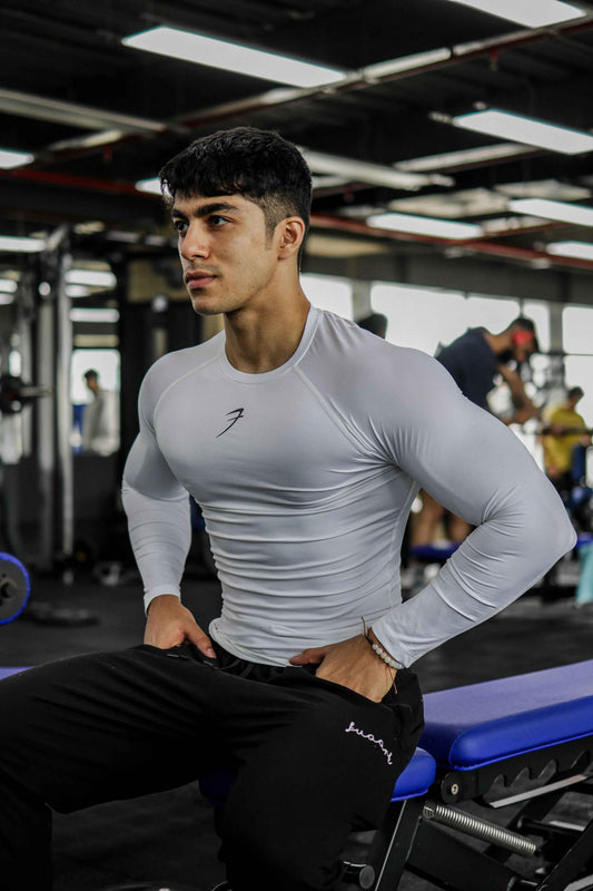White compression full sleeves T-shirt by Fuaark Nz, designed for enhanced athletic performance and muscle support.