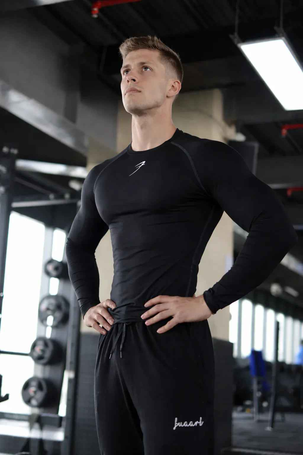 Black compression full-sleeves T-shirt by Fuaark Nz, shown laid flat with smooth fabric and fitted design.