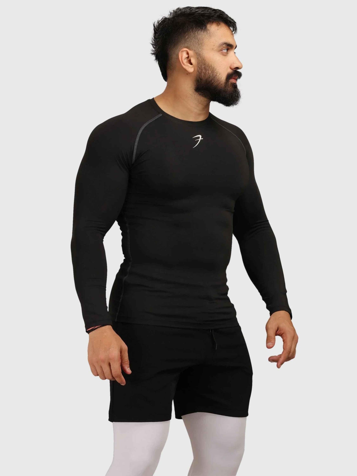 Black compression full-sleeve T-shirt from Fuaark Nz, designed for athletic wear and muscle support.