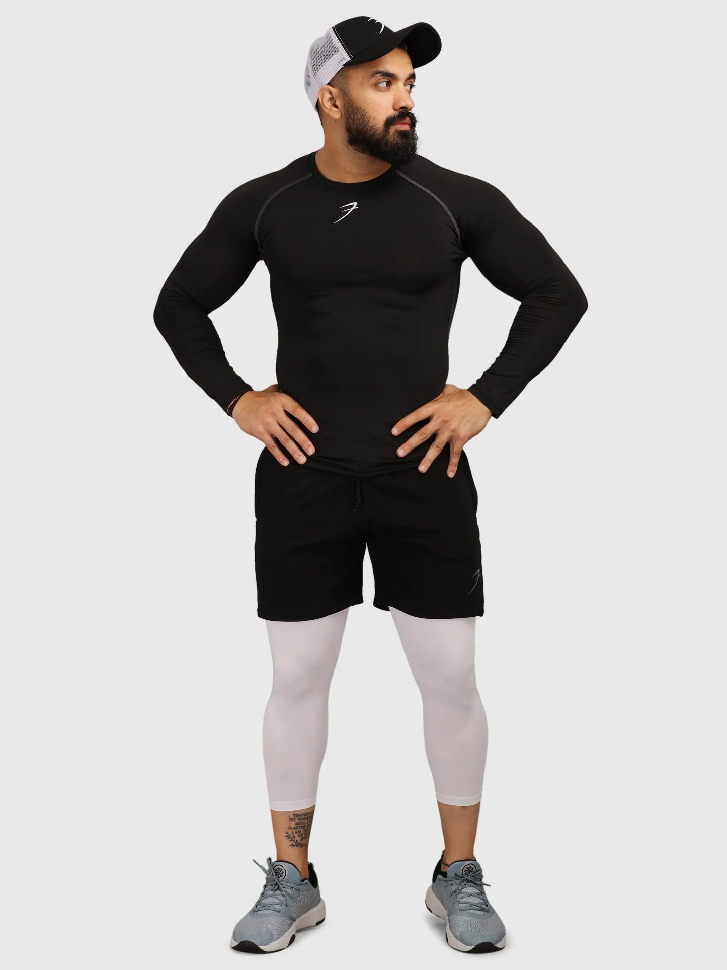 Black Fuaark Nz compression fullsleeves T-shirt, close-up of sleek, fitted athletic T-shirt with long sleeves and branding details