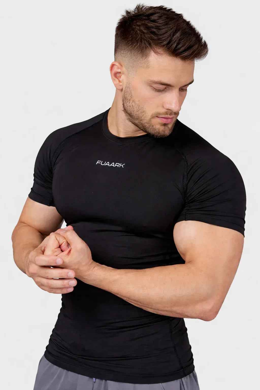 Black Fuaark Nz compression T-shirt designed for ultimate performance and comfort, shown on a model.