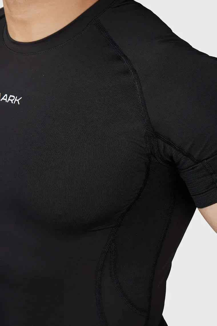 Black compression T-shirt by Fuaark Nz designed for ultimate performance and comfort, shown on a model.