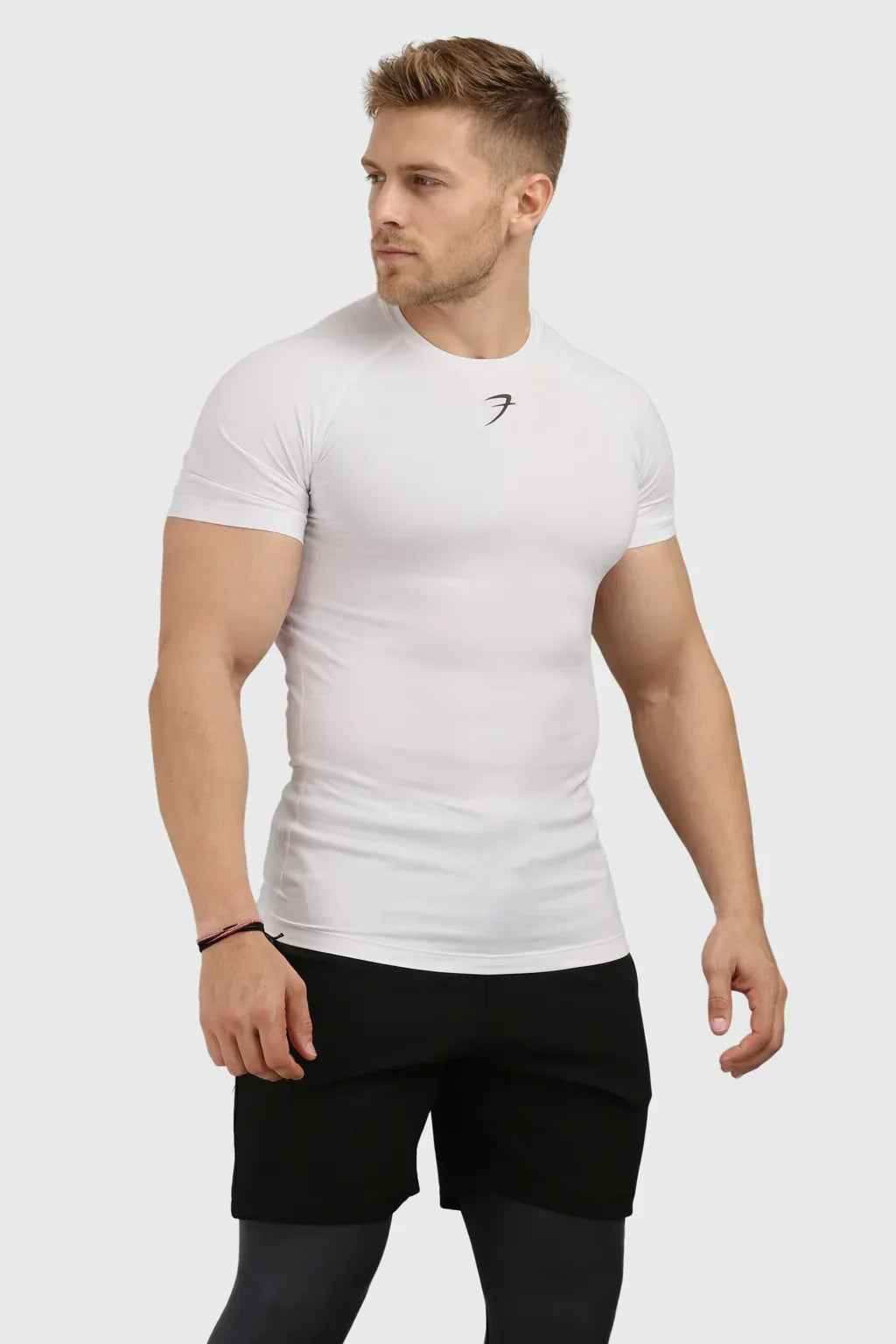 White Fuaark Nz performance compression T-shirt, designed for athletic comfort and enhanced game elevation.