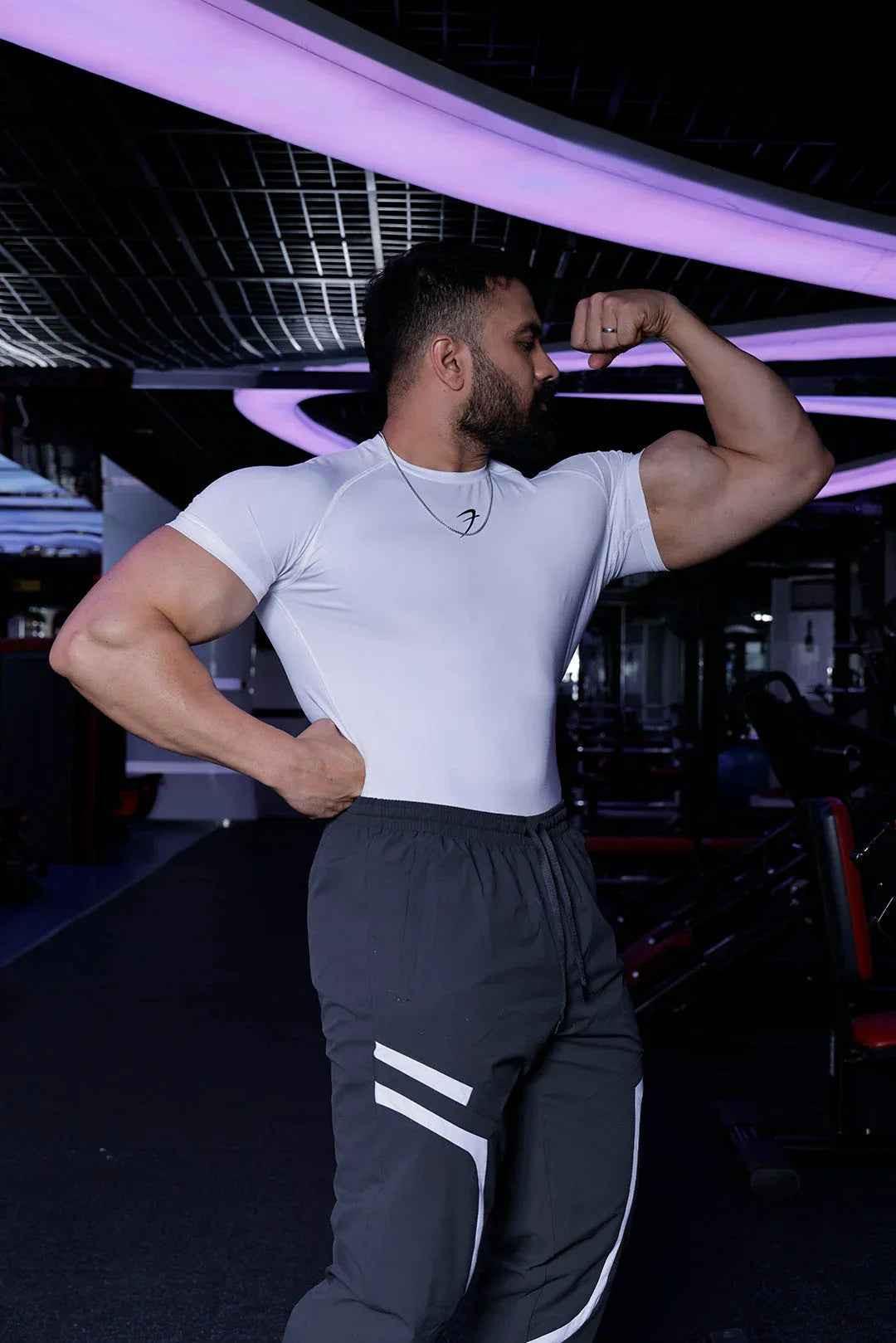White performance compression T-shirt by Fuaark Nz, designed for athletic comfort and enhanced movement.