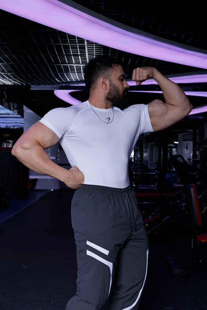 White performance compression T-shirt by Fuaark Nz, designed for athletic comfort and enhanced movement.
