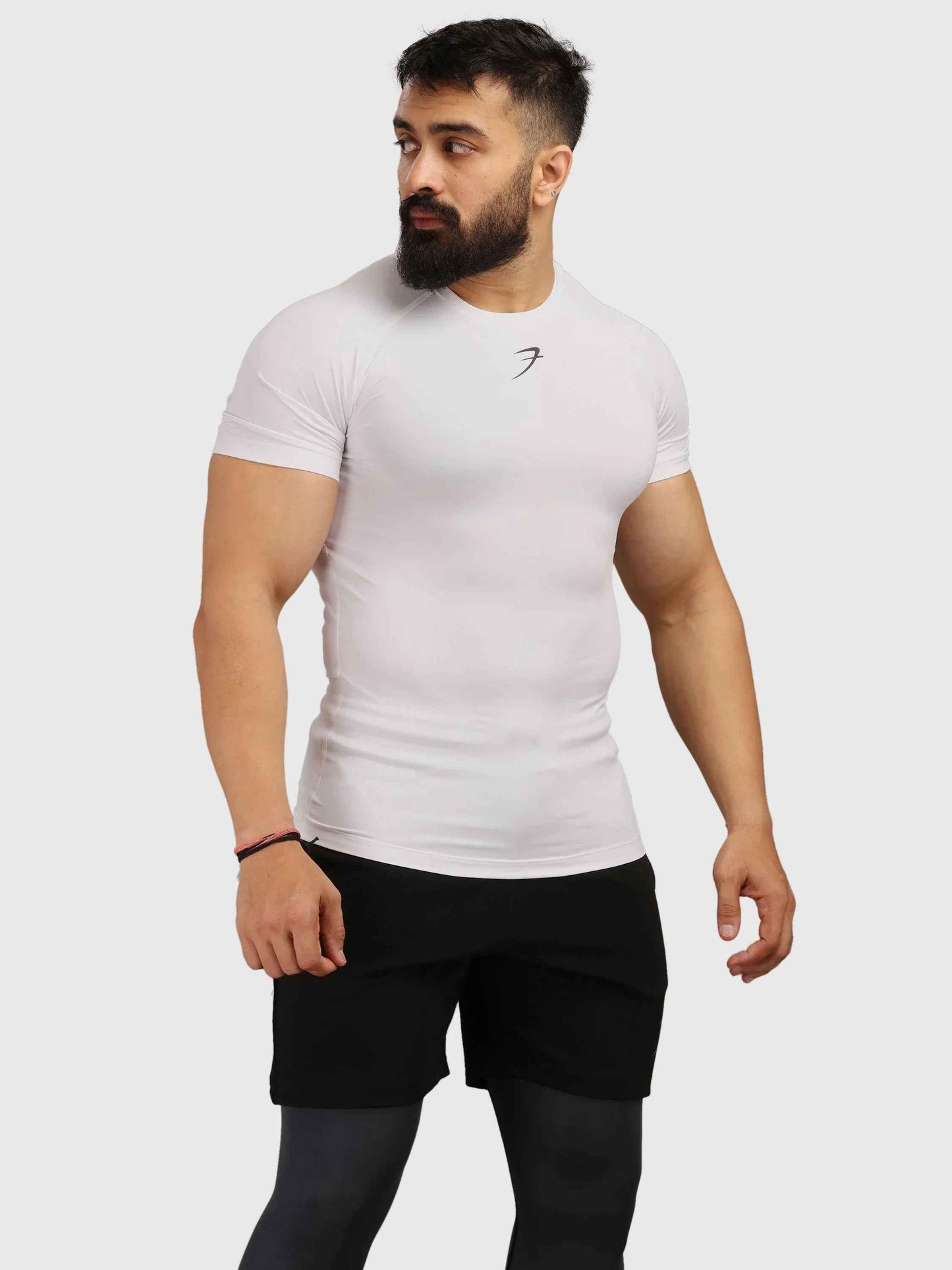 White Fuaark Nz performance compression T-shirt, designed for athletic comfort and support during workouts.