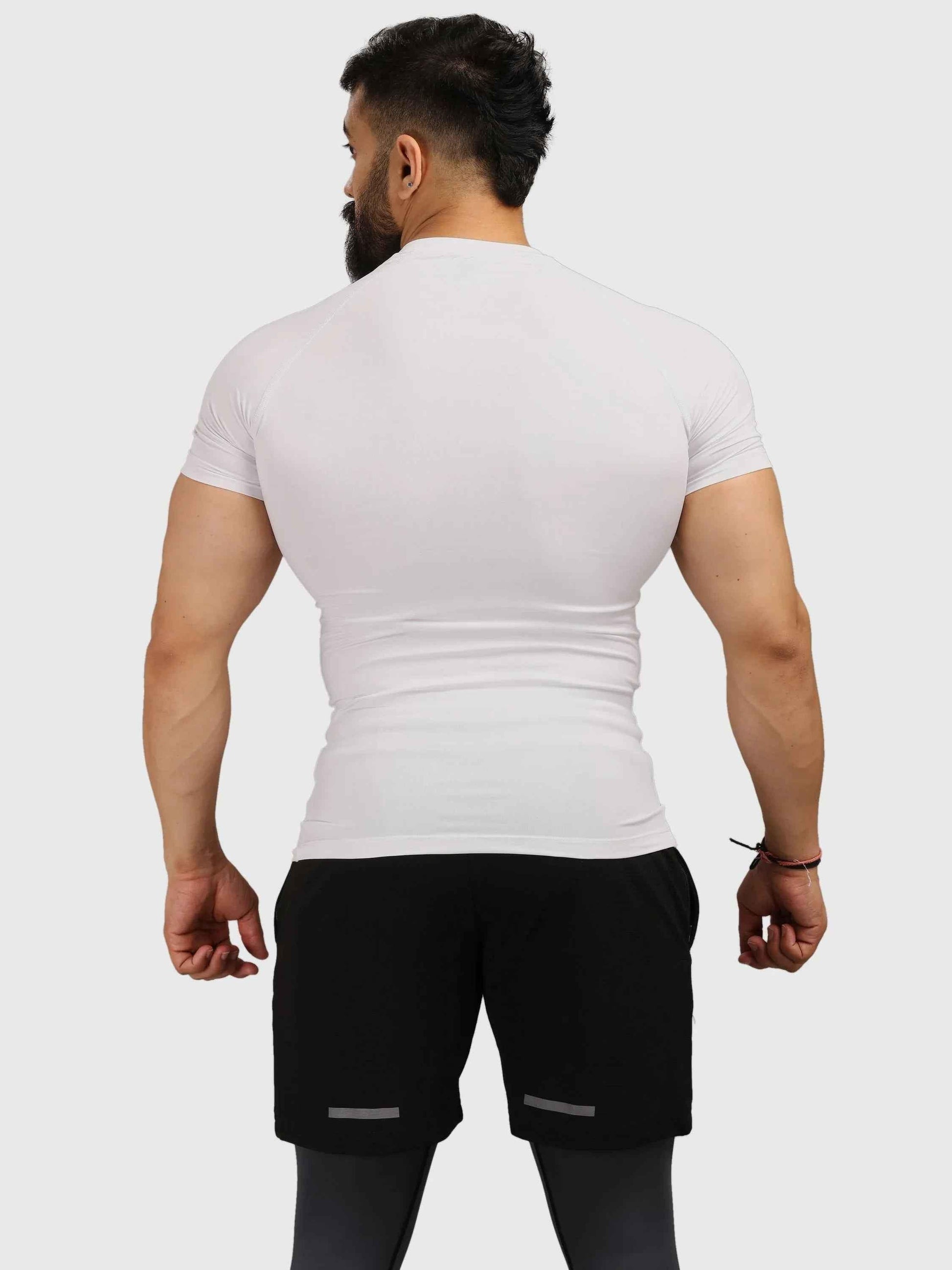 White Fuaark Nz performance compression T-shirt, designed for athletic comfort and support during workouts.