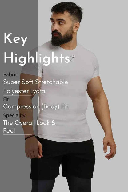 White Fuaark Nz performance compression T-shirt designed for athletes, featuring a close-up of the fitted athletic fabric.