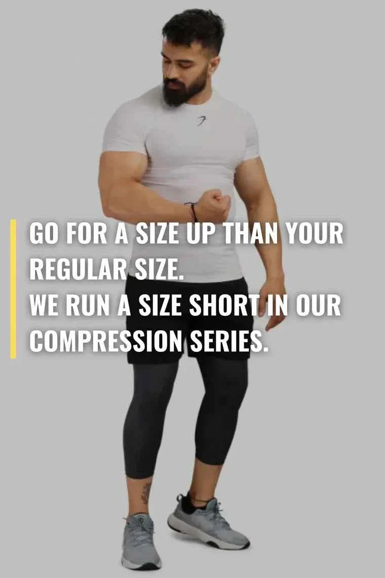 White Fuaark Nz performance compression T-shirt designed for athletic activity, showcasing a fitted, breathable fabric.