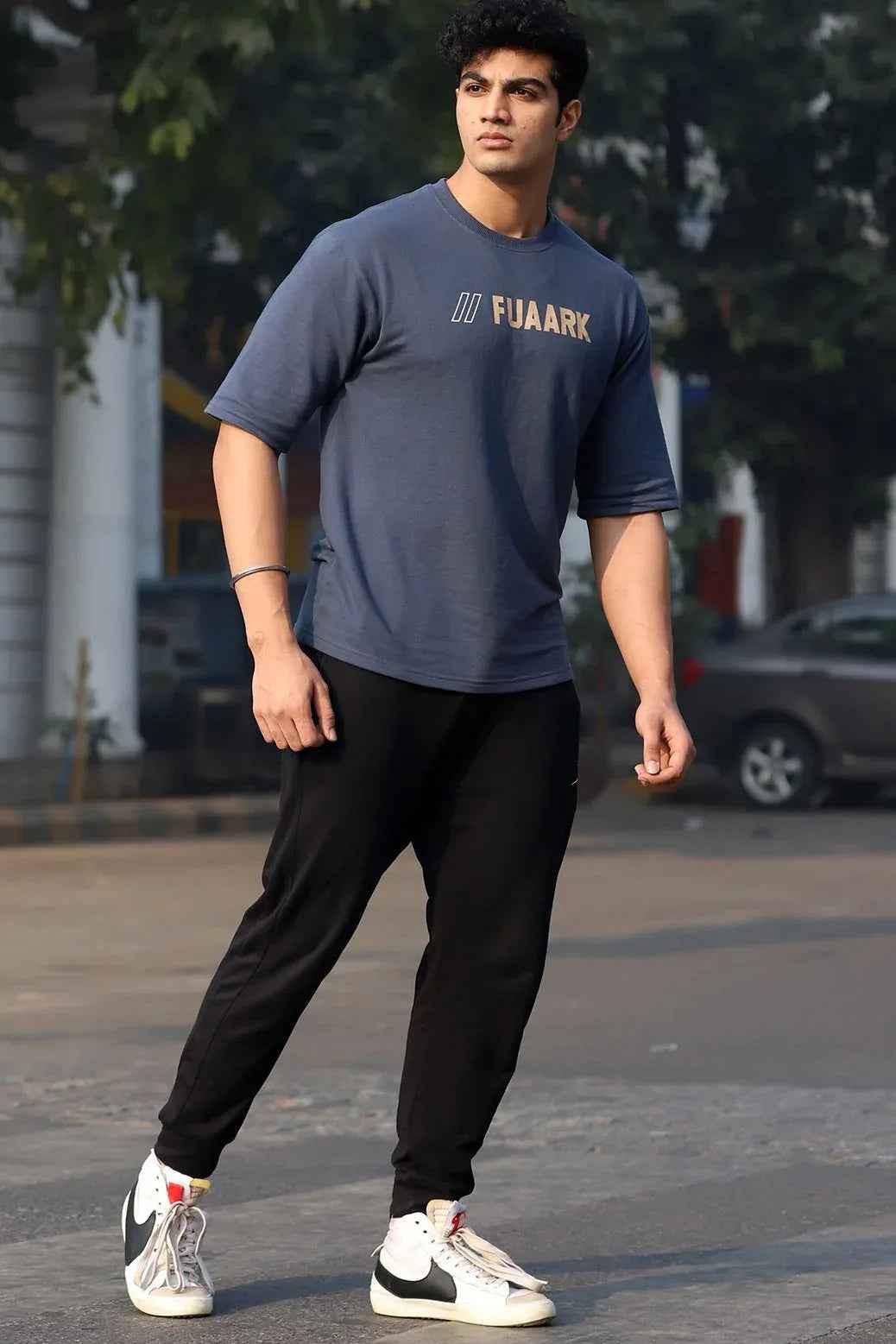 Fuaark Nz Greatest Oversized Grey T-Shirt laid flat, showing its relaxed fit and soft fabric, casual streetwear style.