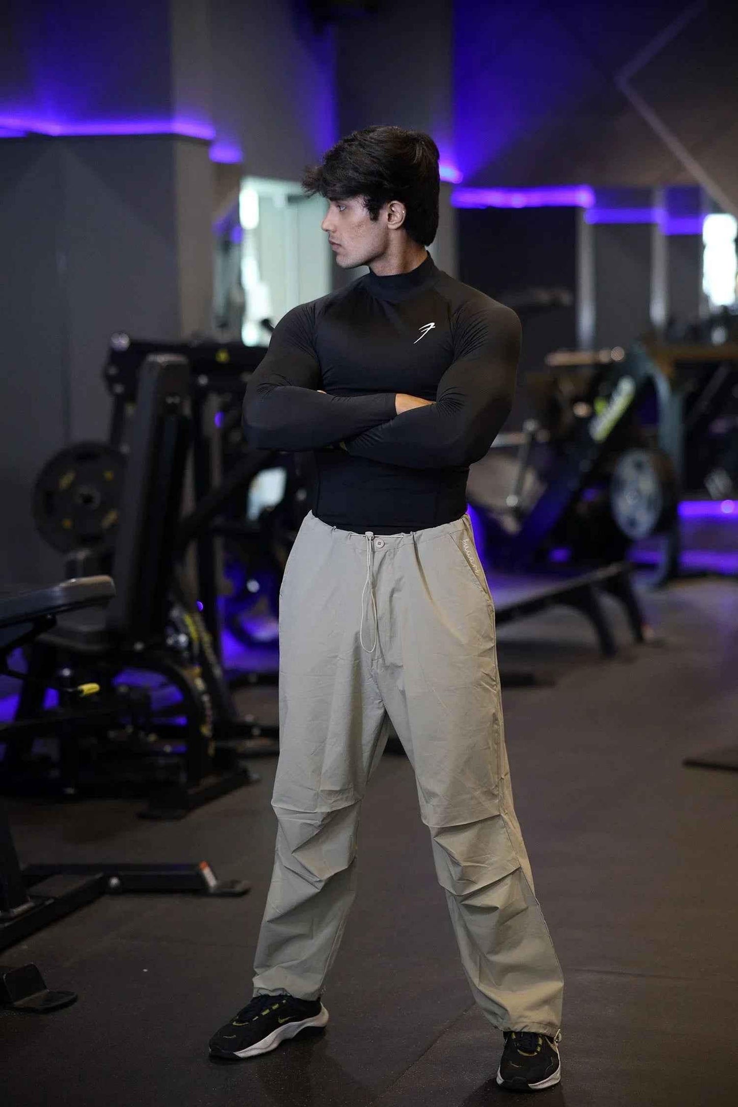 Black high neck compression T-shirt by Fuaark Nz with full sleeves, designed for performance and athletic wear.