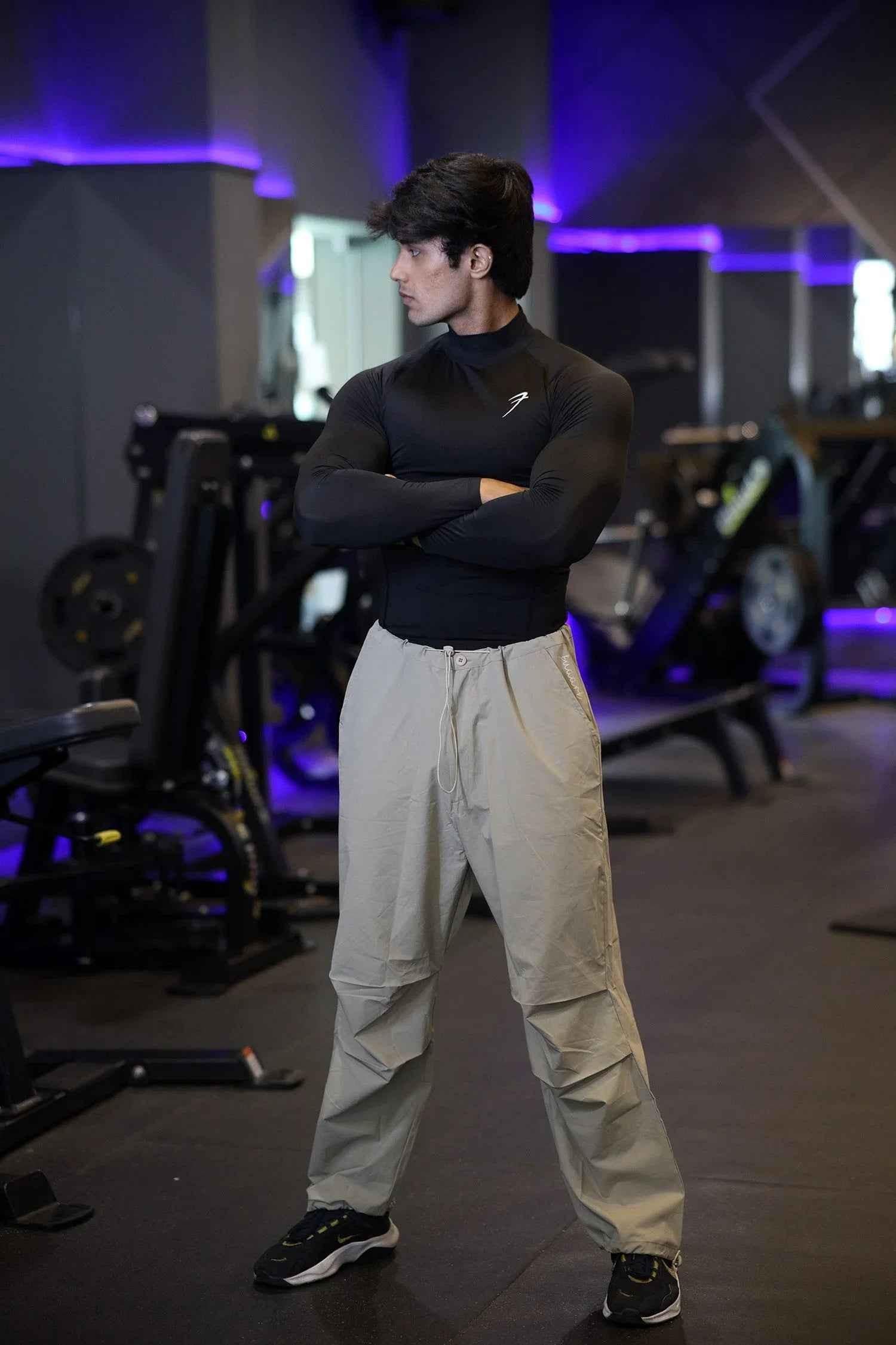 Black high neck compression T-shirt by Fuaark Nz with full sleeves, designed for performance and athletic wear.