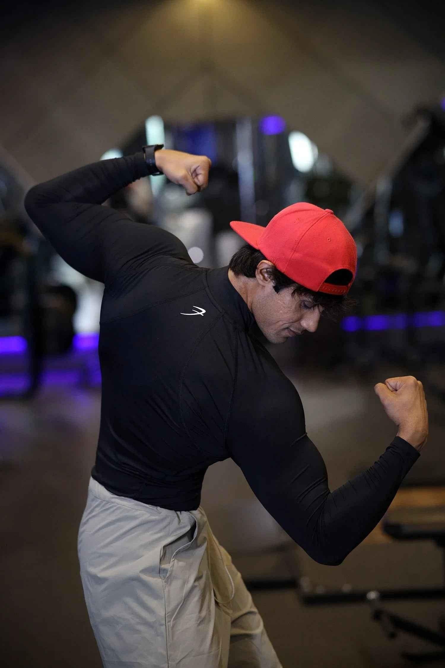 Black high-neck compression T-shirt by Fuaark Nz with full sleeves, designed for performance and athletic wear.