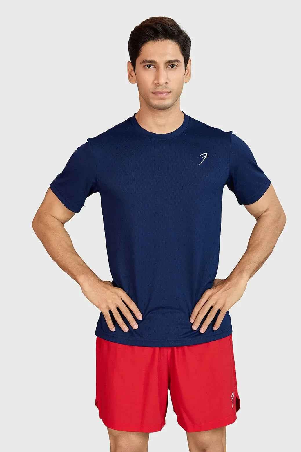 Navy high-performance running T-shirt by Fuaark Nz, made for comfort and active wear, shown on a model.