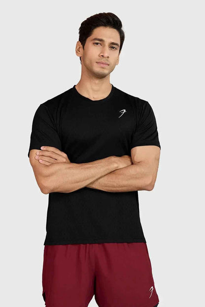 Black Motion Running T-shirt by Fuaark Nz, featuring lightweight fabric and athletic fit, displayed on a hanger.